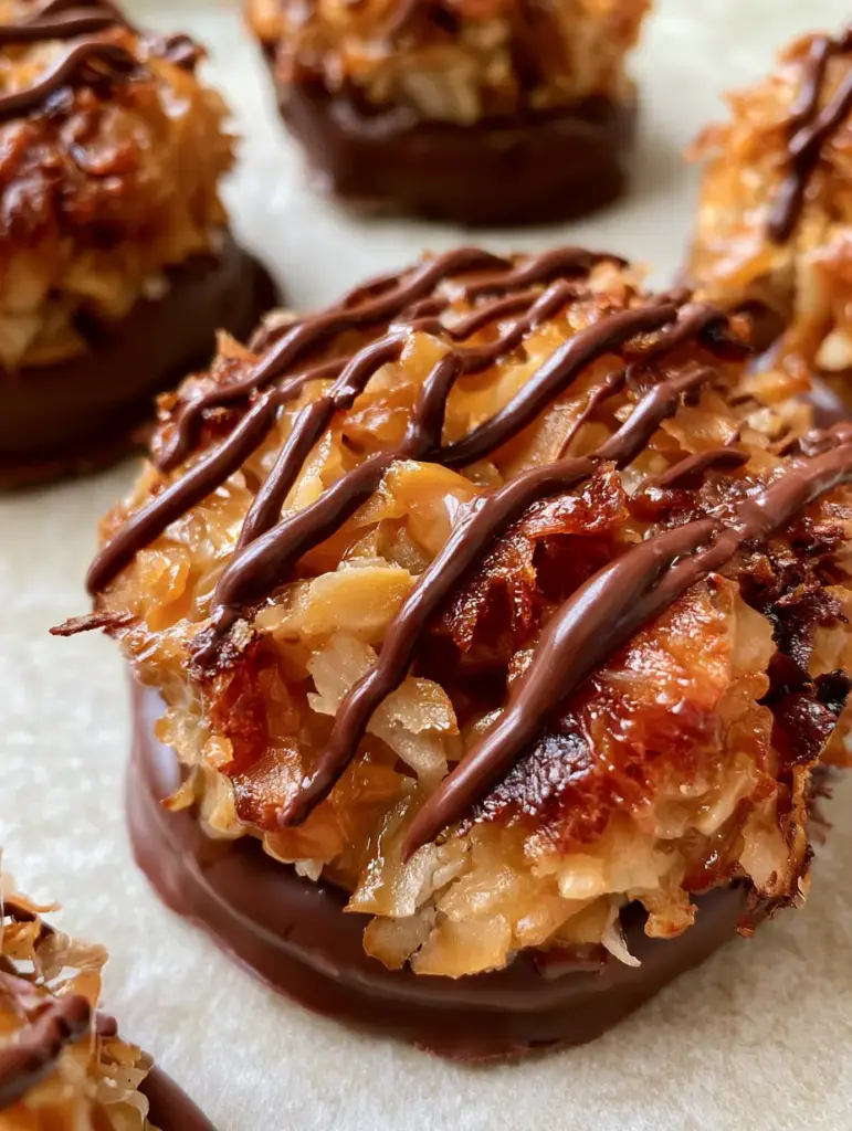 No-Bake Samoa Cookies: Easy Toasted Coconut & Caramel Treats 1 A precise zigzag drizzle of glossy dark chocolate over the amber caramel coconut topping of a No-Bake Samoa Cookie.
